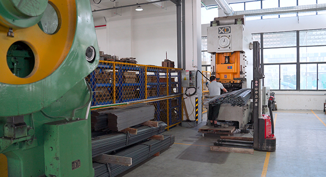 Goto Electric's Workers Is Operating Processing Equipment