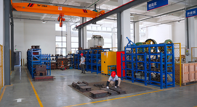 Goto Electric's Workers Is Placing Molds In The Mold Workshop